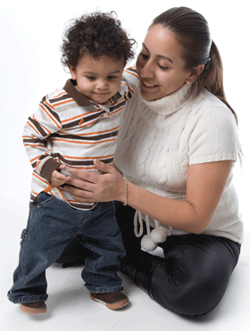 Woman smiling and holding young child