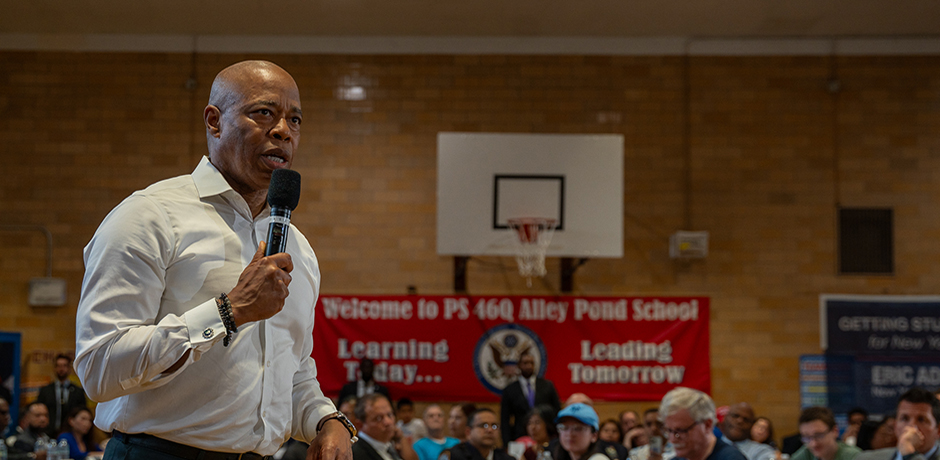 This image shows the Mayor holding a mic addressing a crown of community members at the  Bayside Community Conversation.