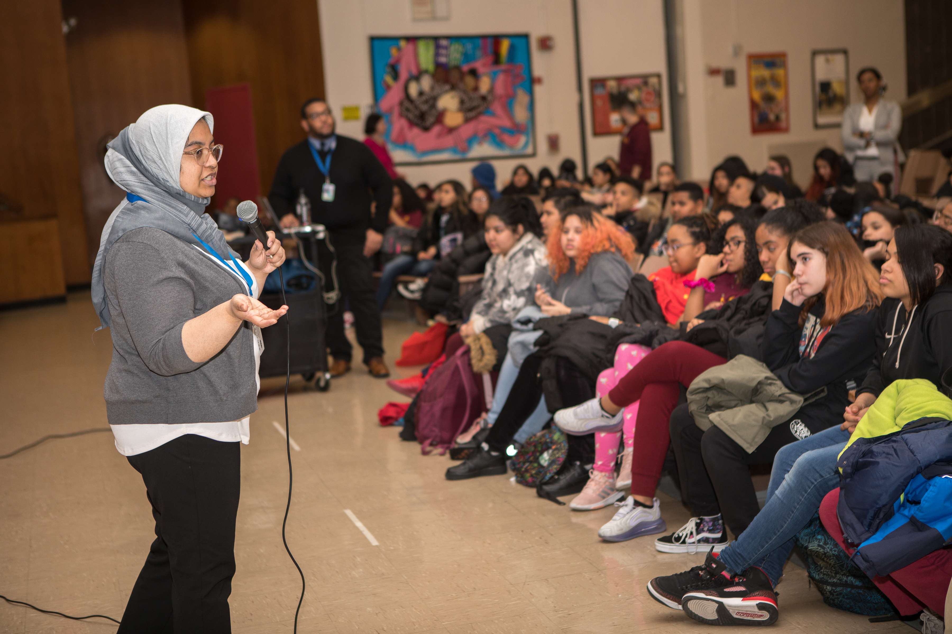 A speaker presenting in front of a room of students
