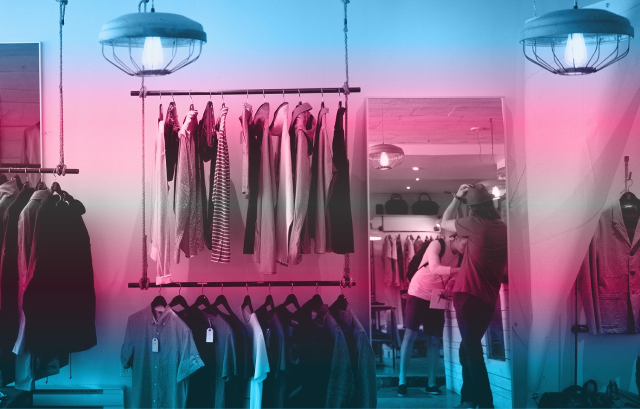 Two men shaking hands and smiling at a camera, with backdrop reading The Fair Chance Act behind them