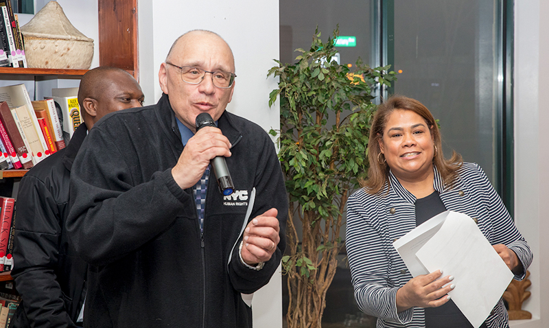 Commissioner Annabel Palma standing next to a Commission staff member holding a microphone