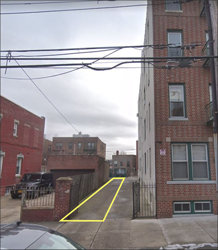 A street with buildings on either side
Description automatically generated with low confidence