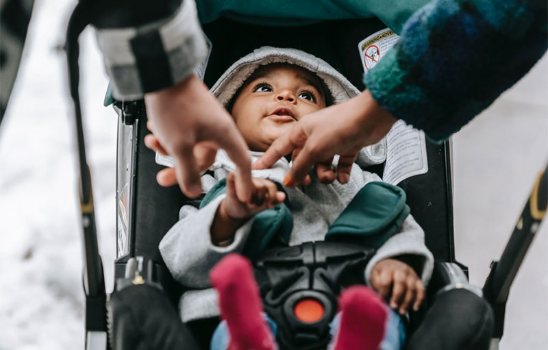 Photo of stroller with baby.