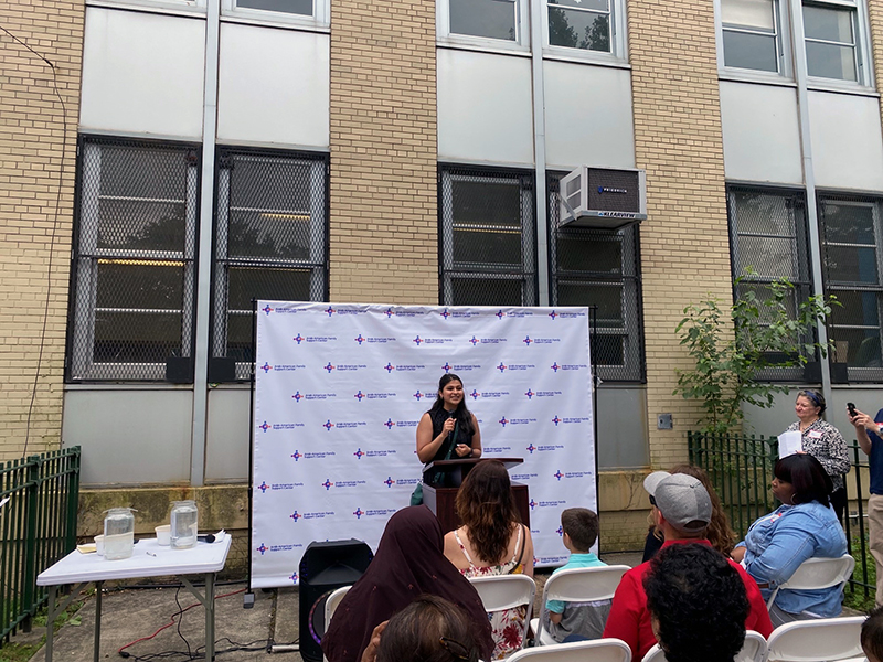 NYC Civic Engagement Commission  speaking at the event to members of the community