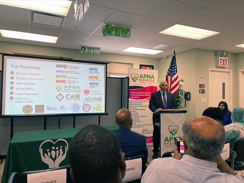 Presenter speaks to members of the community at the APNA  Brooklyn Community Center