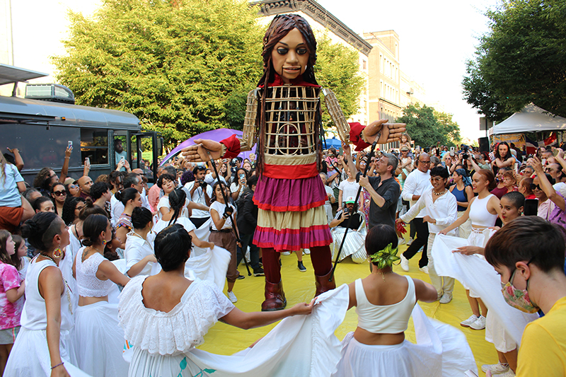 The crowd welcoming Little Amal