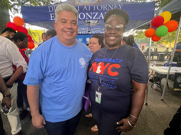 a man in light blue t-shirt and a woman staff in dark blue t-shirt