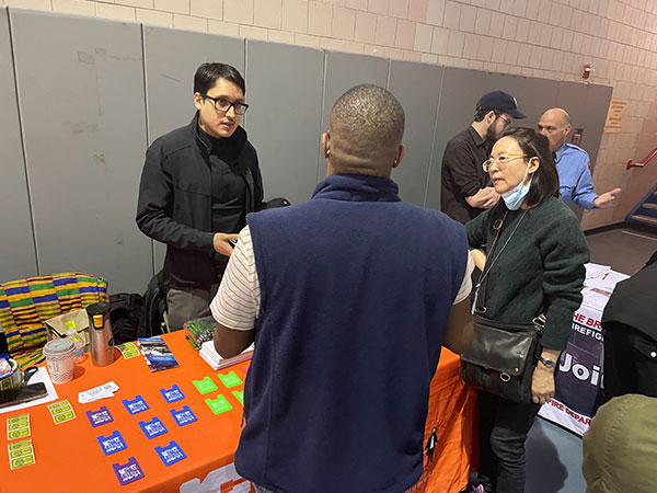 Outreach staff sharing resources.