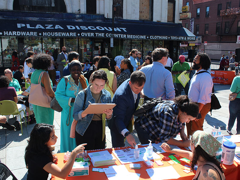 The crowd at the People's Money event engaged in conversation.