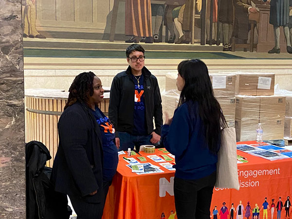 CEC staff sharing resources with attendees at the summit.