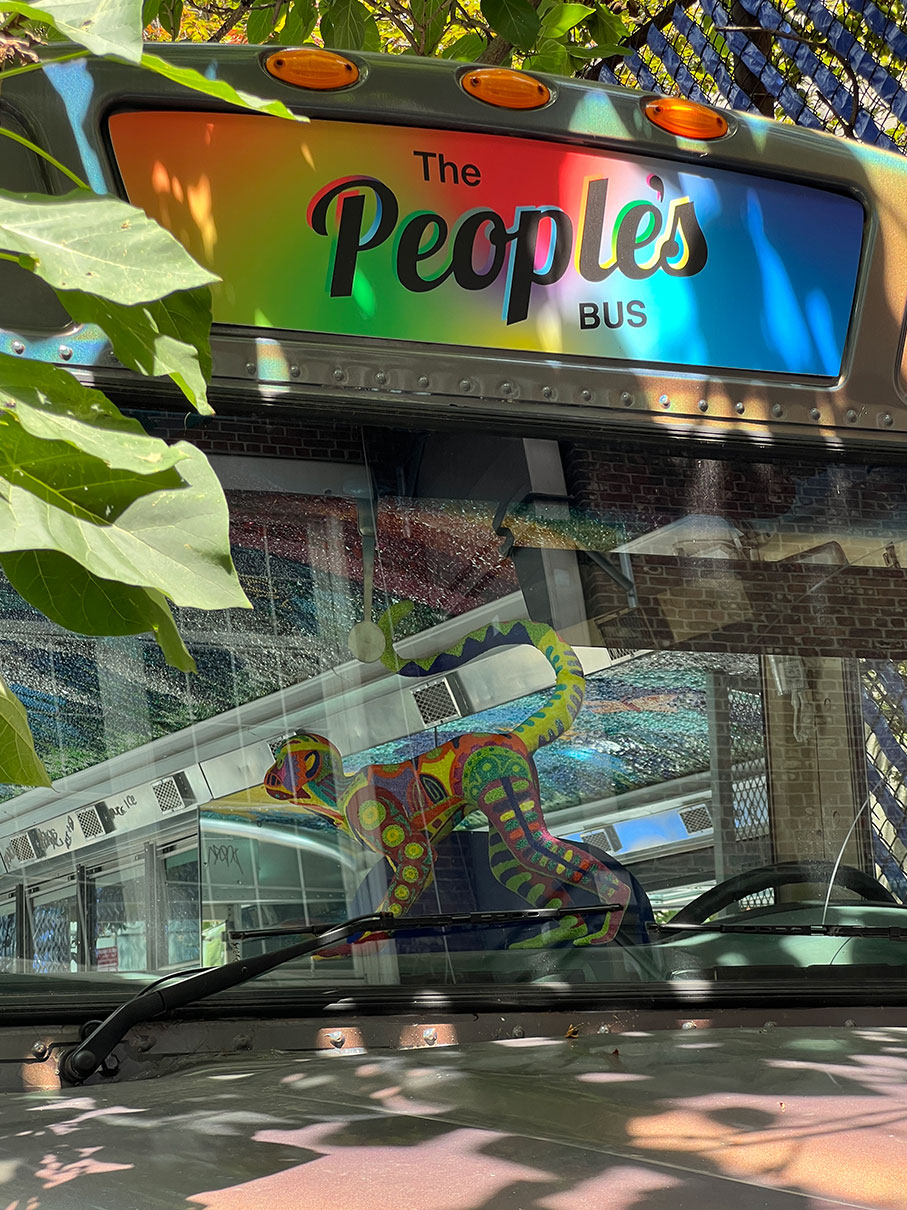 Monkey cut out card board is rest at the front glass of the bus