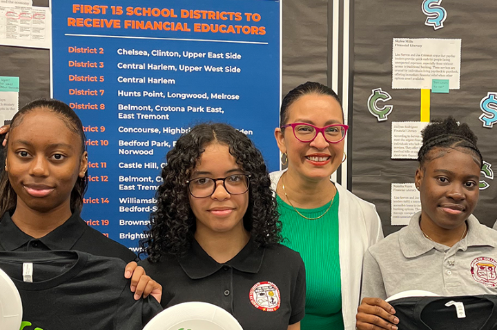 Commissioner Vilda Vera Mayuga and public school students smile together in a classroom.
                                           