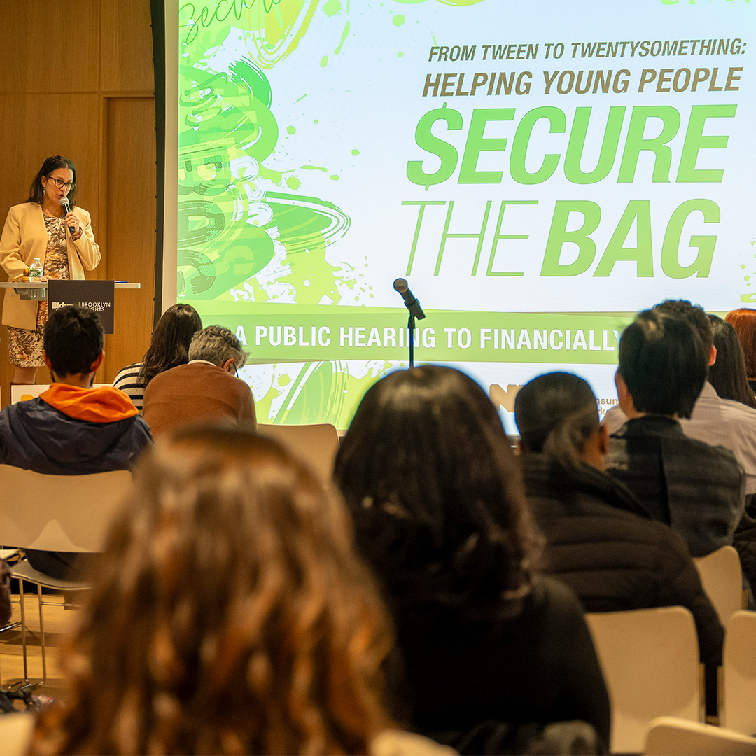 Commissioner Mayuga speaks during youth financial empowerment public forum