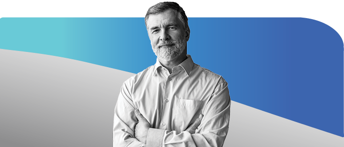 Smiling older man with gray hair and beard, arms folded Smiling older man with gray hair and beard, arms folded