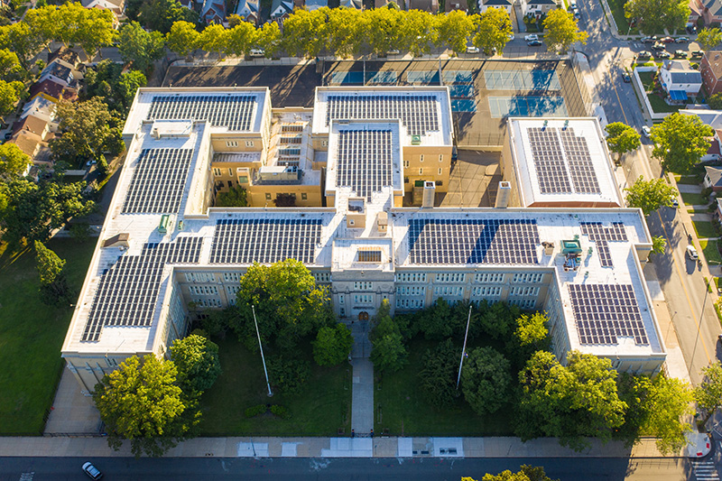 Clean Energy Generation A bird’s-eye view of a solar installation on top of an NYC school building.