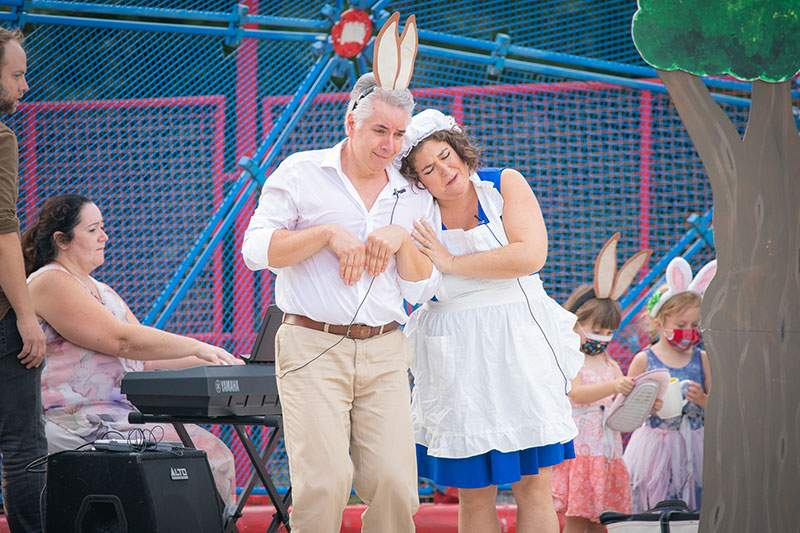 Two people, one with rabbit ears, perform in a production of Peter Rabbit