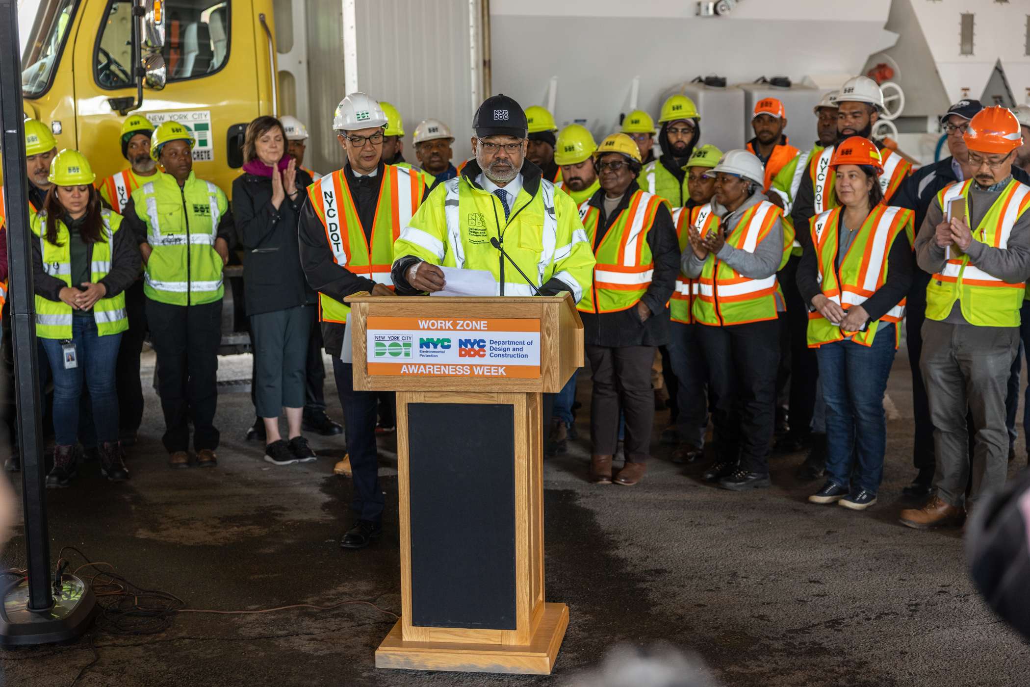 Eric Macfarlane speaks at podium during event