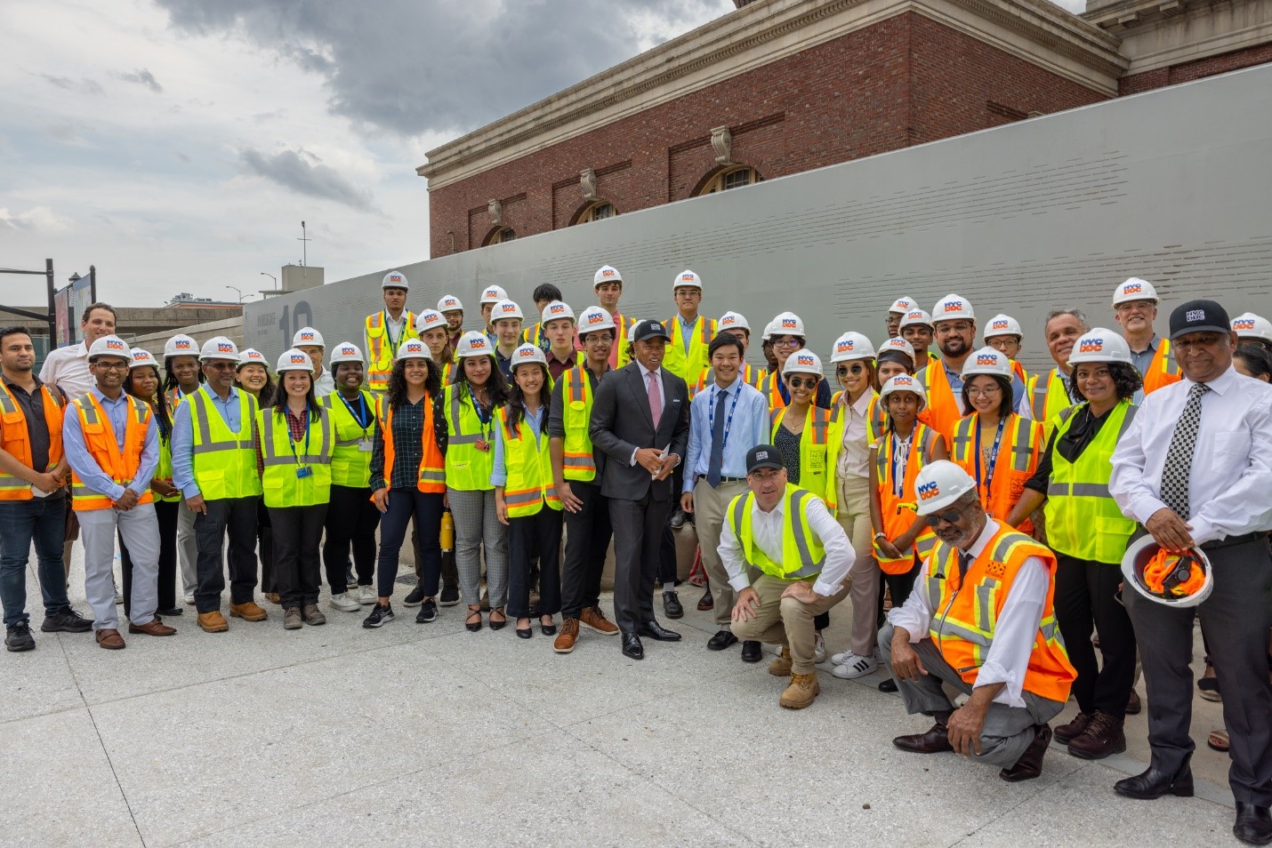 mayor poses with interns and staff