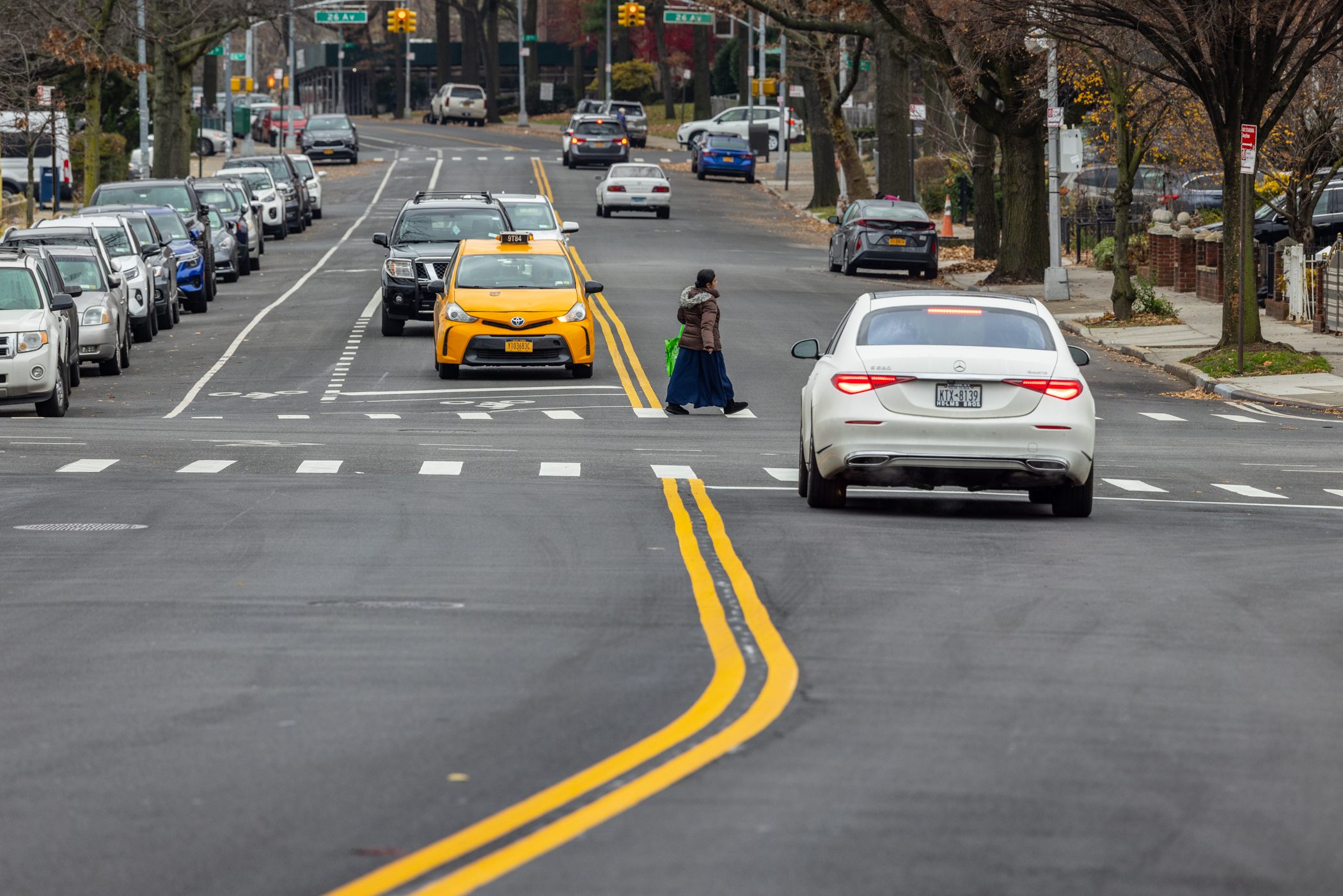 pedestrian crosses street