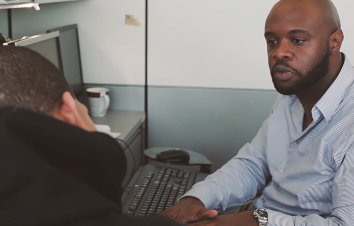 DHS employee attending to a client