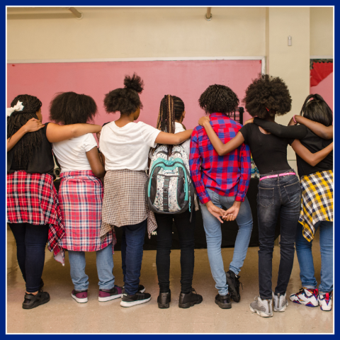 group of students posing with their backs to the camera. The Neighborhood Development Area (NDA) programs.
