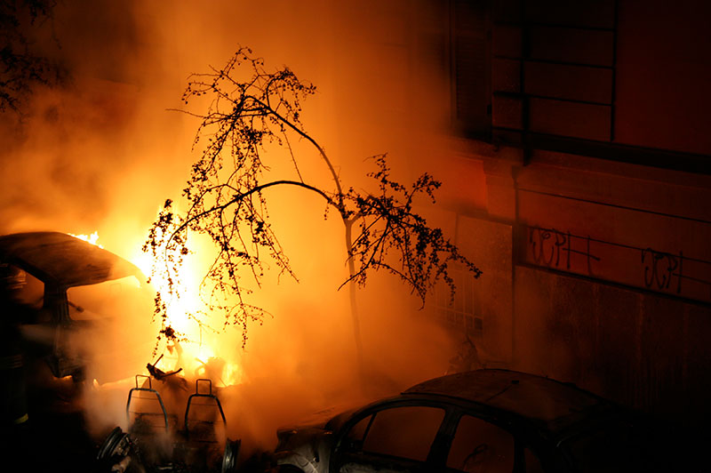 Image of fire and smoke outside of a building