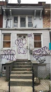 image of a run-down abandoned home.