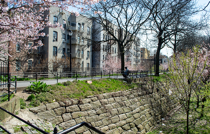 Elevated walkway atop brick embankment
