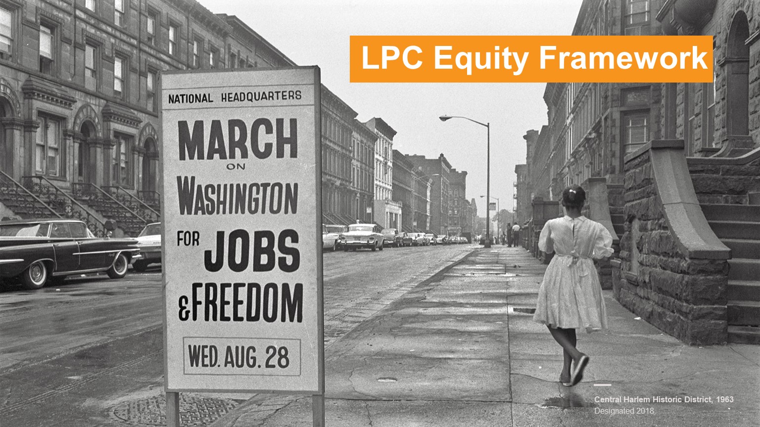 Black and white photo of girl standing next to sign that says March on Washington for Jobs & Freedom