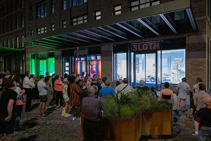 People gather to watch a play on West 13th Street in the Meatpacking District of Manhattan.